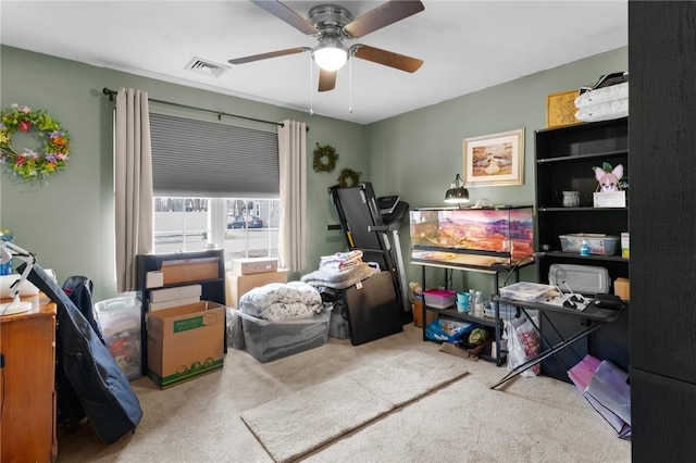 interior space with ceiling fan and visible vents