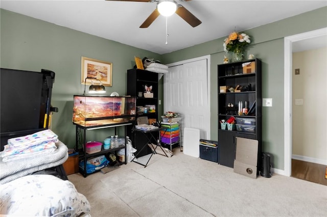 bedroom featuring baseboards, a ceiling fan, and a closet