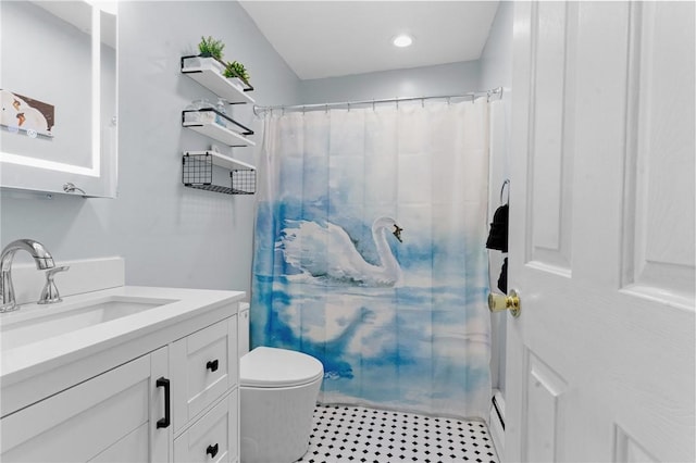 bathroom with toilet, a shower with curtain, baseboard heating, and vanity