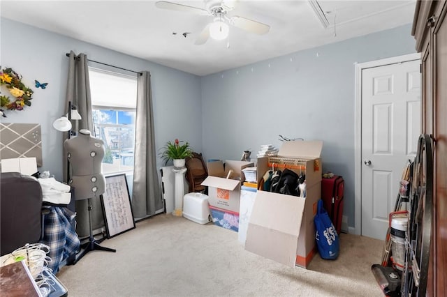 interior space with attic access and a ceiling fan