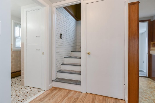 staircase featuring wood finished floors