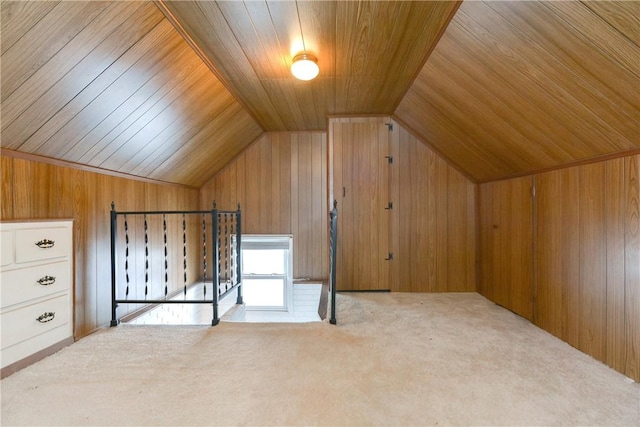 bonus room with vaulted ceiling, carpet floors, wooden ceiling, and wooden walls