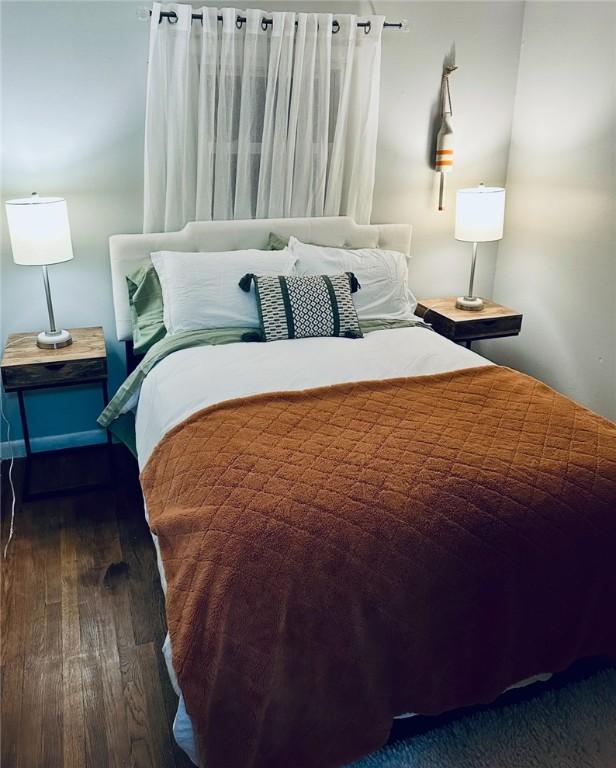 bedroom featuring wood finished floors