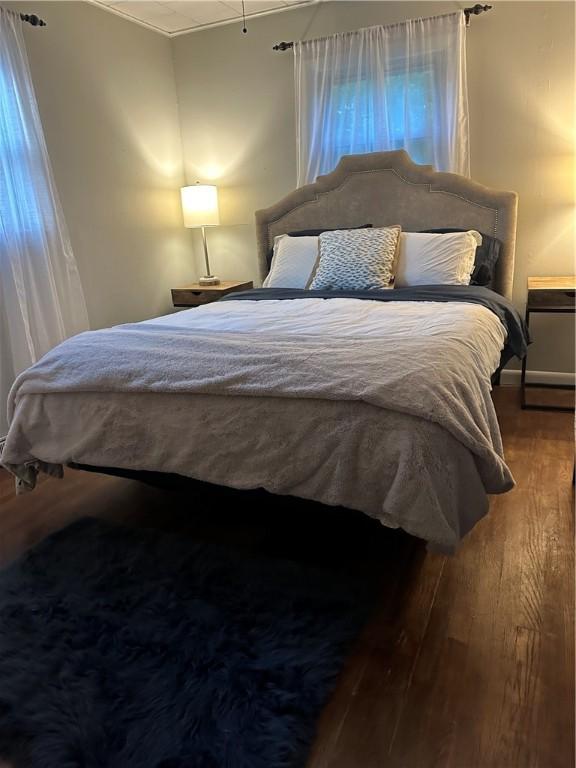 bedroom featuring wood finished floors