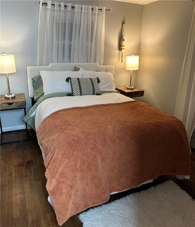 bedroom featuring wood finished floors