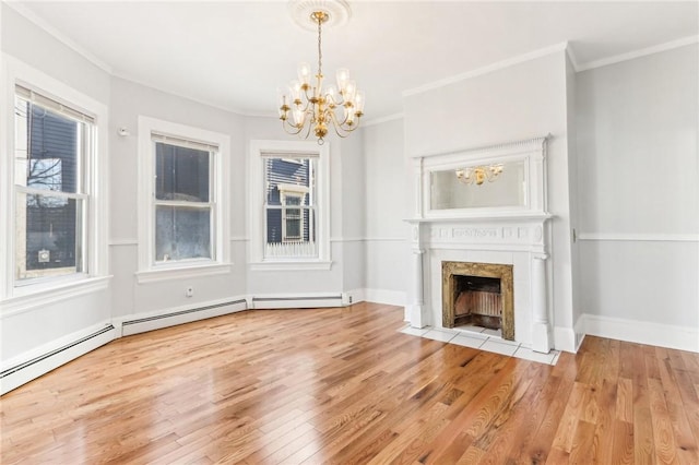 unfurnished living room featuring hardwood / wood-style floors, a fireplace, and ornamental molding