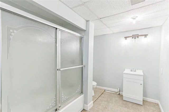 full bath with a shower with door, visible vents, toilet, and a paneled ceiling