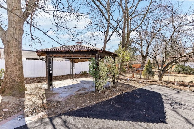 view of yard featuring a gazebo, a patio, and fence