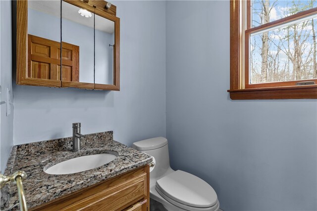 bathroom with vanity and toilet