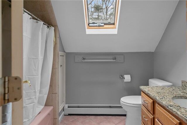 full bathroom featuring lofted ceiling with skylight, a baseboard radiator, vanity, and toilet