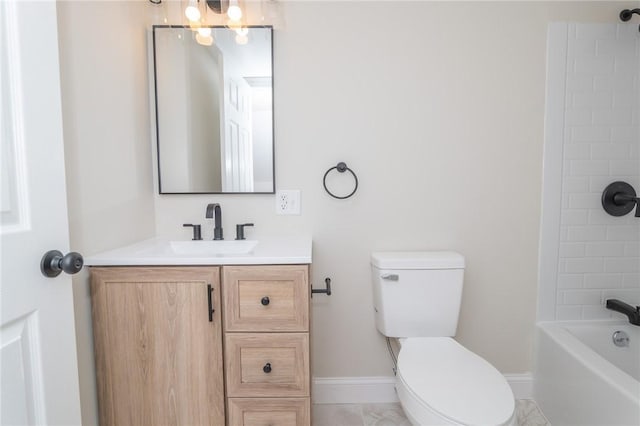 bathroom featuring toilet, baseboards, shower / washtub combination, and vanity