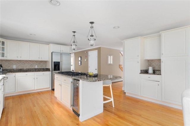 kitchen featuring white cabinets and a kitchen breakfast bar