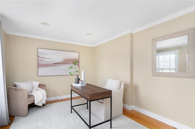 home office with light wood finished floors, baseboards, and ornamental molding