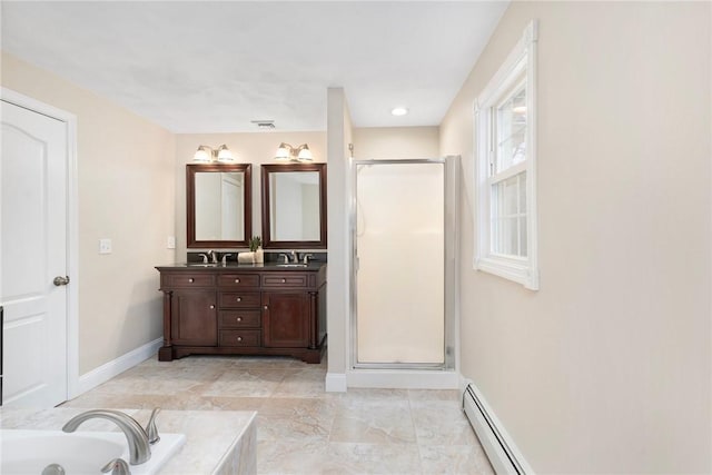 full bathroom featuring a stall shower, a garden tub, a sink, and double vanity