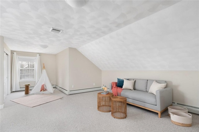 recreation room featuring carpet floors, a baseboard heating unit, visible vents, and vaulted ceiling