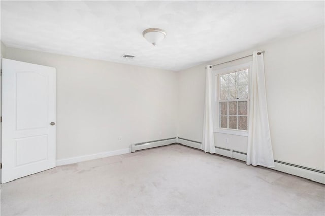 empty room featuring carpet floors and baseboards