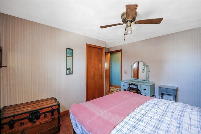 bedroom featuring a ceiling fan and wood finished floors