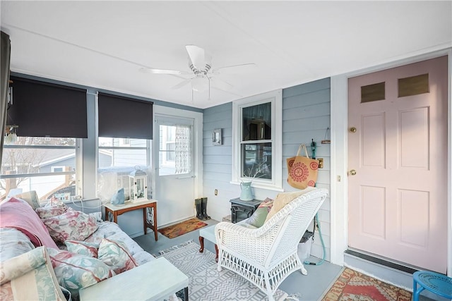 sunroom with a ceiling fan