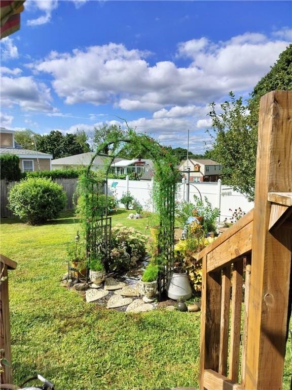 view of yard with a fenced backyard