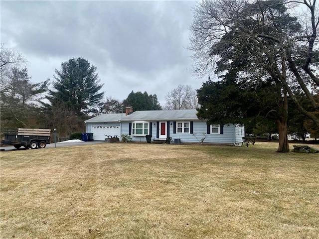 single story home with entry steps, a front yard, a garage, and a chimney