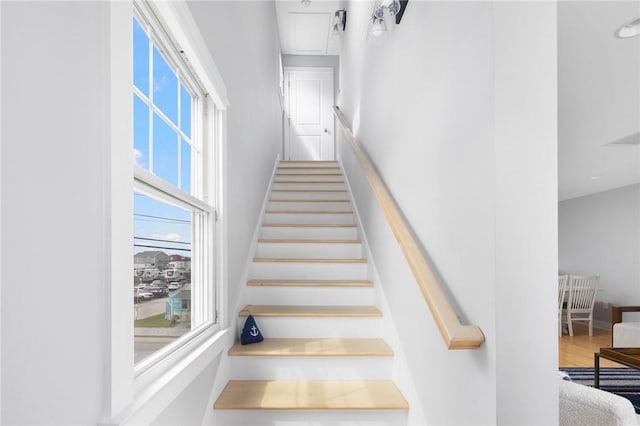 stairway with wood finished floors