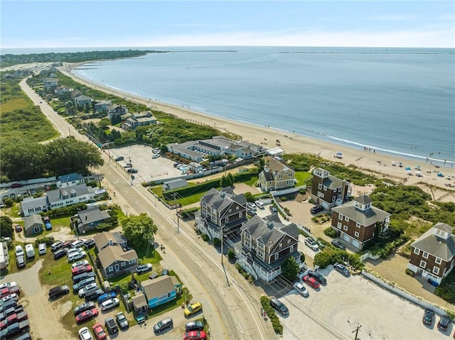 birds eye view of property with a water view and a view of the beach