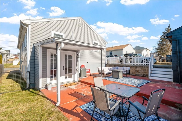 back of house featuring fence, an outdoor hangout area, and a patio