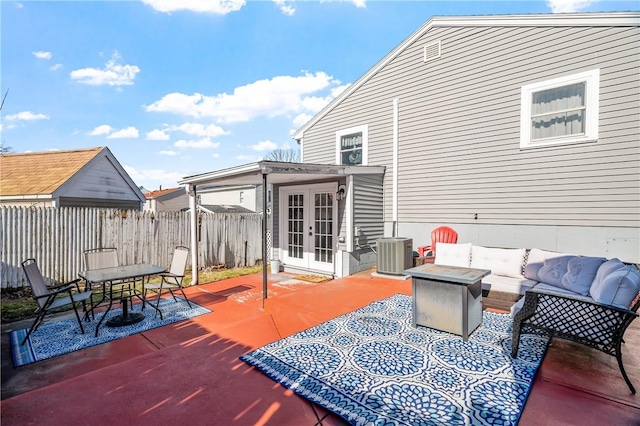 view of patio / terrace featuring french doors, outdoor lounge area, outdoor dining space, central AC, and fence