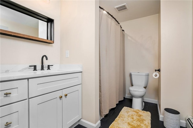 bathroom with visible vents, baseboard heating, toilet, vanity, and baseboards