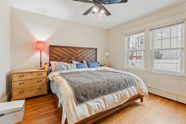 bedroom with ceiling fan and hardwood / wood-style floors