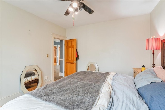 bedroom featuring ceiling fan and baseboards