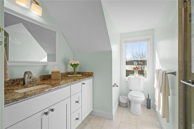 full bath with toilet, a stall shower, baseboards, vanity, and vaulted ceiling