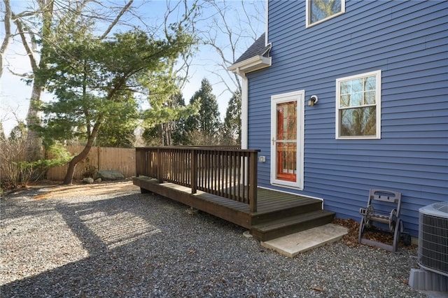 wooden deck featuring fence and central AC