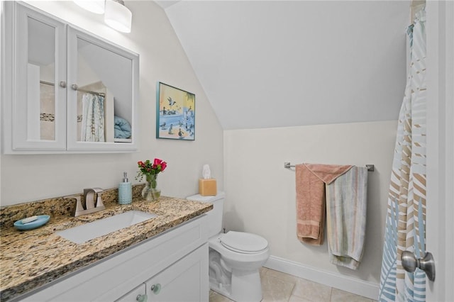 bathroom featuring tile patterned floors, toilet, vanity, and lofted ceiling