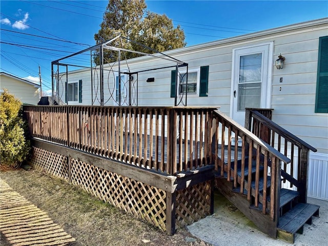 rear view of house featuring a deck