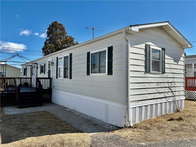 view of side of home featuring a deck