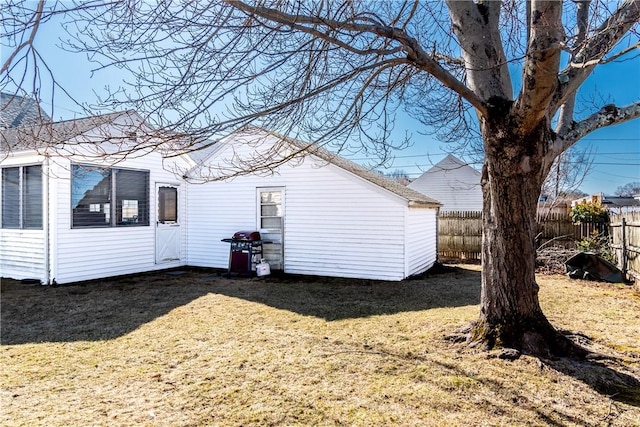 exterior space with a yard and a fenced backyard