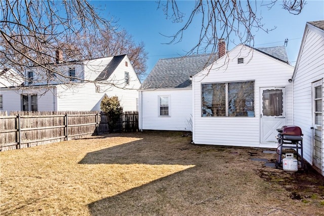 view of yard with a fenced backyard