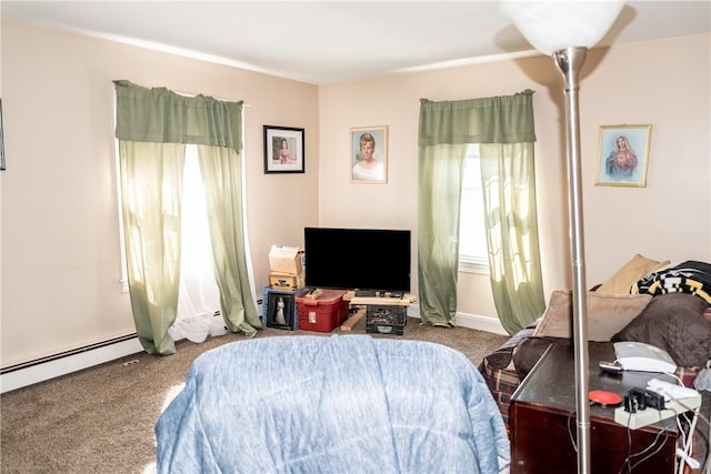 bedroom with carpet floors and baseboard heating