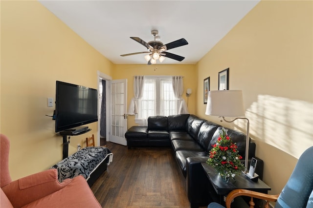 living room with a ceiling fan and dark wood-style flooring