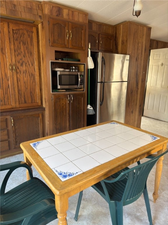 game room featuring wood walls