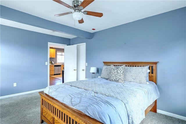 carpeted bedroom with a ceiling fan and baseboards