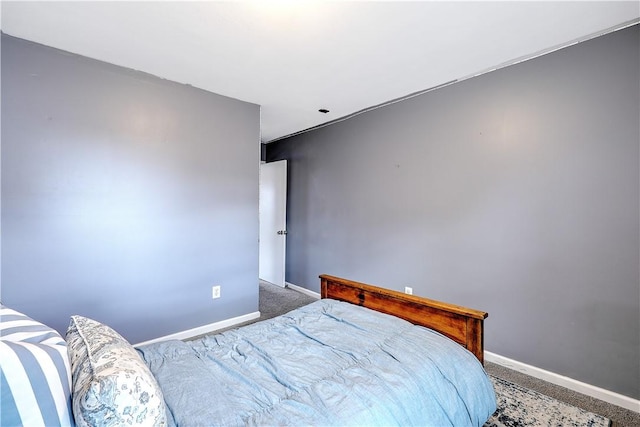 carpeted bedroom with baseboards