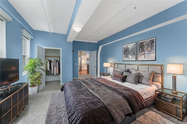 carpeted bedroom featuring freestanding refrigerator