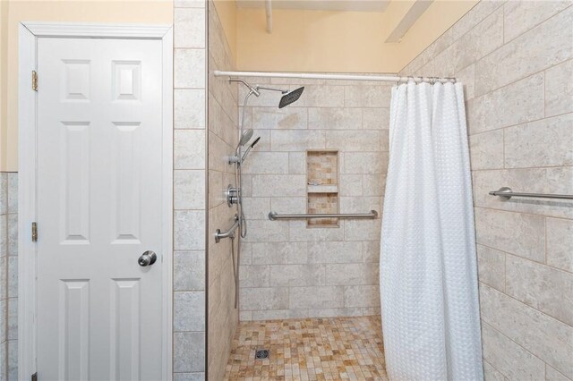 bathroom with a shower stall