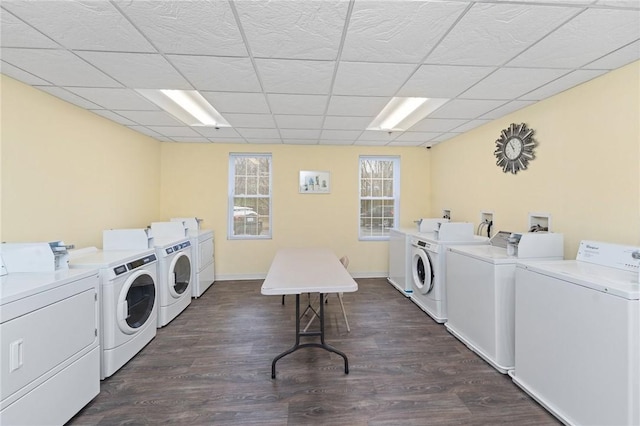 common laundry area with baseboards, dark wood-type flooring, and independent washer and dryer