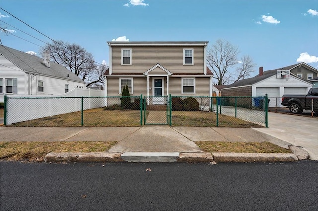 colonial inspired home featuring a fenced front yard and a gate