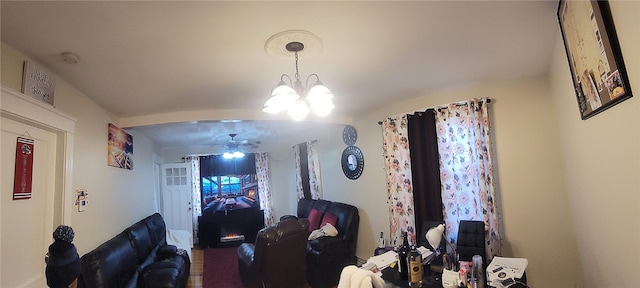 dining room featuring ceiling fan with notable chandelier