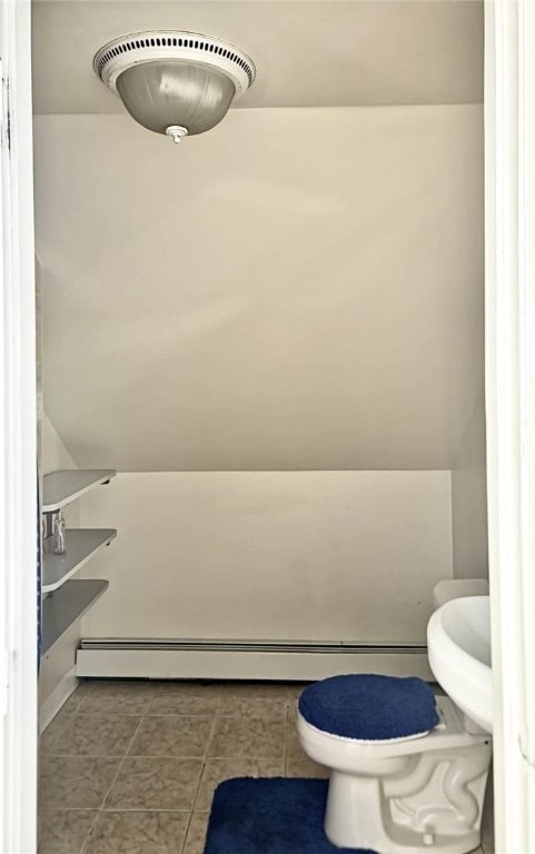 bathroom featuring tile patterned flooring, visible vents, and toilet