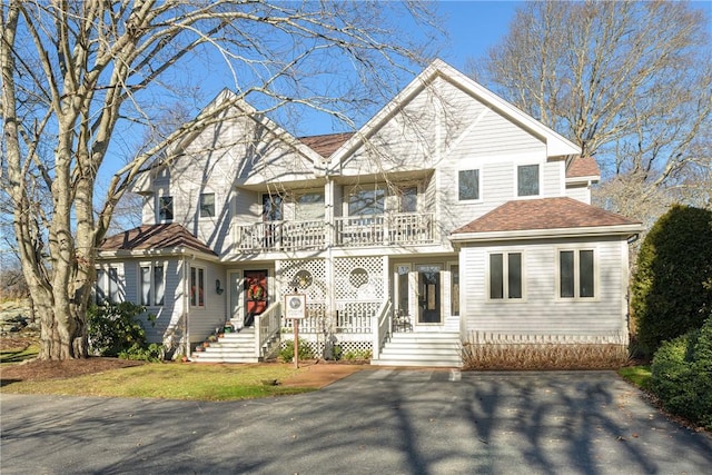 view of front of house featuring a balcony